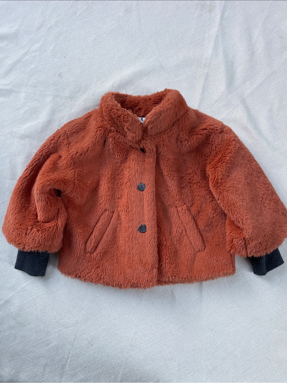 stem Plush Faux-Fur Puffer Jacket in Rust Orange